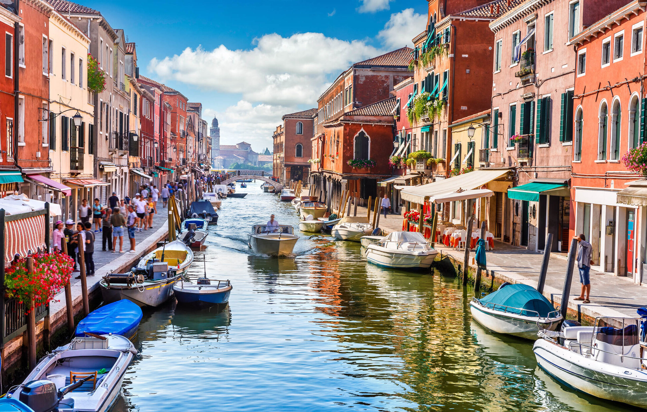 Island murano in Venice Italy. View on canal with boat and motorboat water. Picturesque landscape.